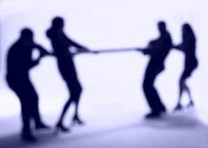 Conflict Management Image - Two groups playing "Tug-o'-War"